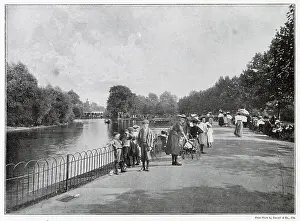 Holloway Prints: Children standing near the artificial lake in Finsbury Park, London. Date: 1901
