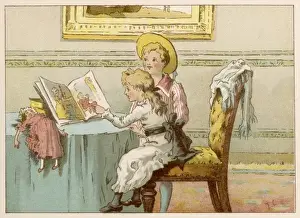 Children at table with picture book