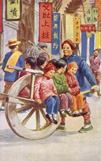 Transported Prints: Children transported to school by wheelbarrow - China