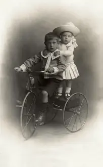 Sibling Prints: Children on a tricycle