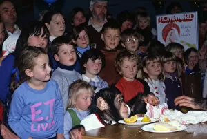 Children watching a chimps tea party