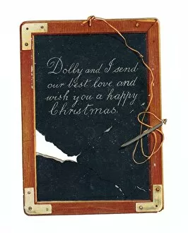 Images Dated 9th December 2015: Childs slate with pen and greeting on a Christmas card