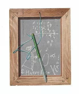 Maths Collection: Childs slate with pen and scribbles on a New Year card