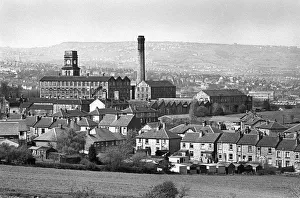 Images Dated 27th August 2019: Mill chimney and terraced houses in Huddersfield, Yorkshire