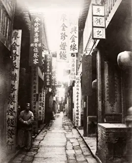China, Canton, Guangzhou street scene shops and banners