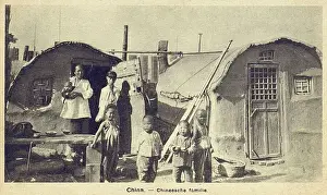 Shacks Prints: China - Poor Chinese family in simple small dwellings