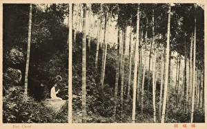 China - Shanghai - Bat Cave - Lady perching on side of hill