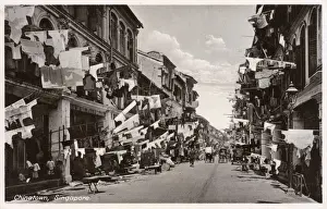 Drying Prints: Chinatown, Singapore - drying clothes on long poles