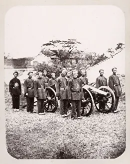 Chinese artillery soldiers, with cannon, China