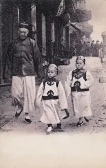Tunics Prints: Two Chinese children in traditional attire with their Father