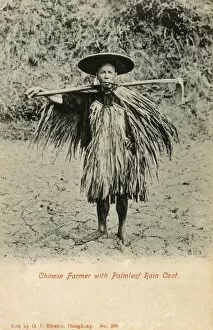 Images Dated 8th February 2016: Chinese Farmer with Palmleaf Raincoat carrying hoe