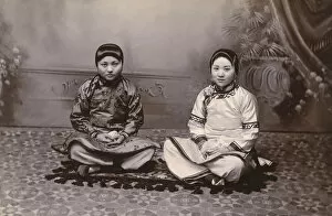 Images Dated 8th February 2016: Two Chinese Girls seated on a small rug