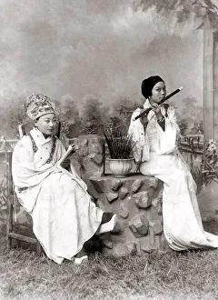 Chinese perfomers, girl palying a flute, China, c. 1890 s