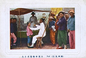 Images Dated 8th February 2016: Chinese Street Doctor assessing a young patient
