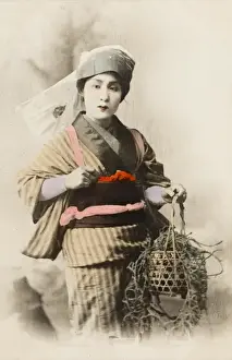 Chinese Woman carrying a plant