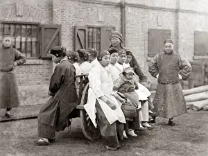 New Images May Prints: Chinese women on a wheelbarrow, China, circa 1880s. Date: circa 1880s