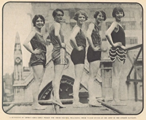 Chorus girls practise water stunts on roof of London Pavilio Chorus girls practise water stunts on roof of London Pavilio