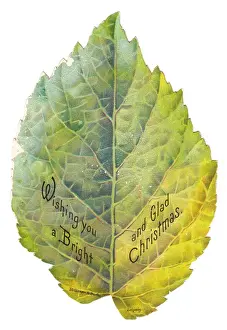 Christmas card in the shape of a green leaf