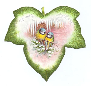 Images Dated 8th December 2015: Christmas card in the shape of a green leaf with birds
