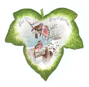 Christmas card in the shape of a green leaf with birds