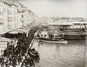 City wharf, busy with boats, probably France or Italy