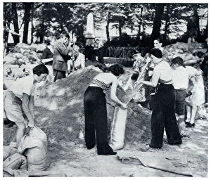 Civilians filling sandbags for air raid shelters 1939