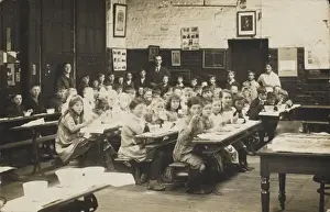Midday Prints: Classroom scene, with pupils eating at their desks