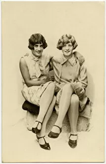 Two close lady friends in stylish attire