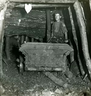 Edwardian Gallery: Coal miner filling truck, South Wales mine