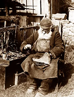 Mending Prints: Cobbler mending shoes