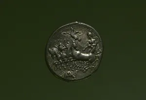 Roman Empire Prints: Coin with depiction of a quadriga driven by a charioteer