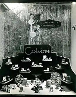 Lighter Prints: Colibri cigarette lighter and cigarette case window display
