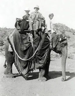 Gents Prints: Colonial India, British gents ride on an elephant