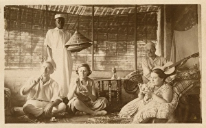 Teatime Collection: Colonial tea party with guitarist and servant