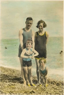 Colour photograph of a family on the beach at Bognor Regis, 1920s. Date: 1920s