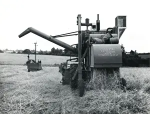 Agricultural Prints: Combine harvester at work in a field, Cornwall