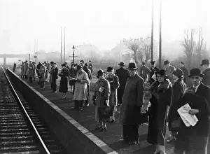 Patiently Prints: Commuters Await Train