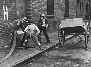 Cobbled Collection: Connecting up a hosepipe during the Blitz