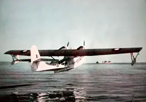 Boeing Prints: Consolidated PBY Catalina (aft) climbing away of Boein