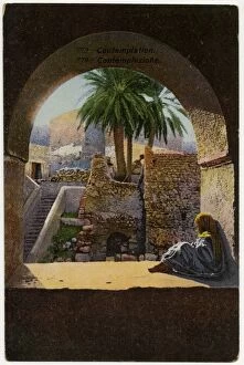 Contemplation - Young child sits beneath an arch - Tunisia
