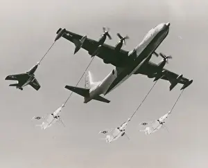 Convair R3Y-2 Tradewind refuelling four Grumman F9F Cougars
