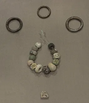 Phoenicians Prints: Copper hair-rings and ring, beads and an amulet