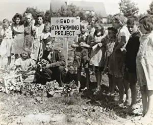A Corporal with German Children Growing Vegetables at th?
