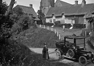 Country scene with thatched cottages
