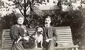 Images Dated 9th October 2015: Couple on a bench with a dog