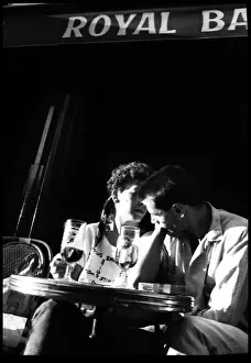Couple at cafe table, Paris, France