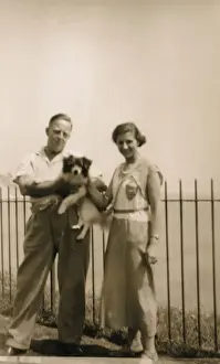 Couple with a dog at a seaside resort