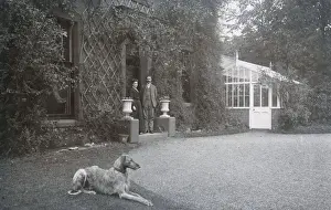 Gravel Prints: Couple in doorway with a dog