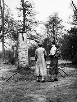 Admire Gallery: A couple of hikers stop to read the inscription on the sundial monument to daylight