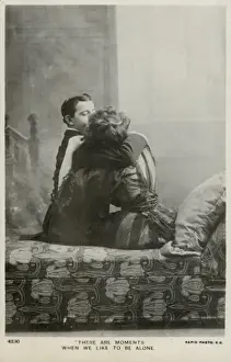 Couple kissing on a chaise longue